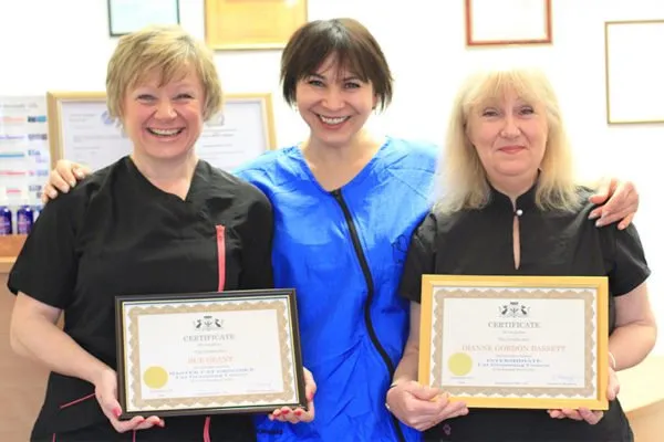 Happy students Sue and Dianne celebrating their graduation with Svetlana